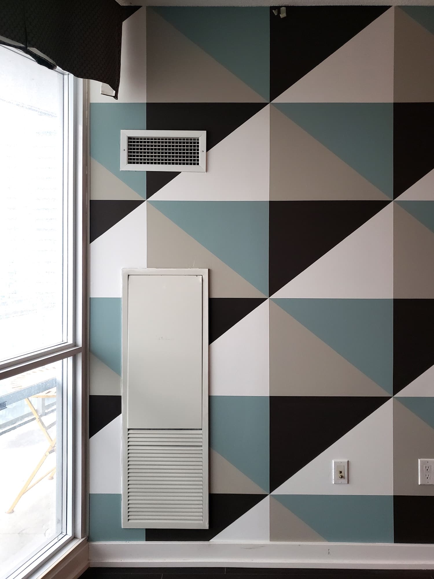 Quiet Composition — vertical detail with a wall vent and HVAC access panel absorbed into the geometry.